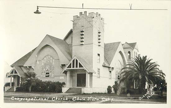 Congregational Church — A wood-frame church with a square bell tower and a street lamp strung over the corner — one of the young city's first civic gathering places.