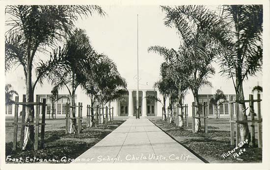 Front entrance, Chula Vista Grammar School — Newly planted palms line the walk to the grammar school's front doors, back when a single school building served the whole lemon town.
